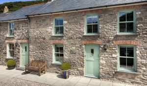 Chartwell green uPVC vertical sliding windows and door