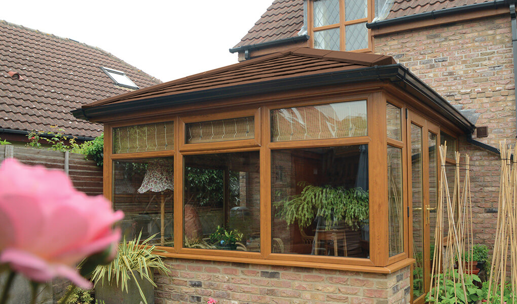 Oak effect Edwardian conservatory with a tiled Supalite roof