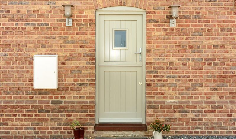 Green timber stable door installation