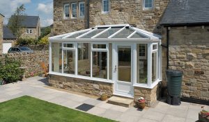White uPVC Edwardian conservatory with a glass roof