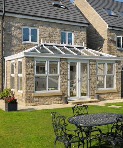 Large white uPVC orangery installation