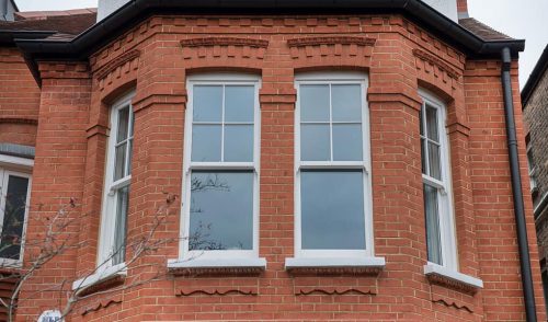 White vertical sliding timber window