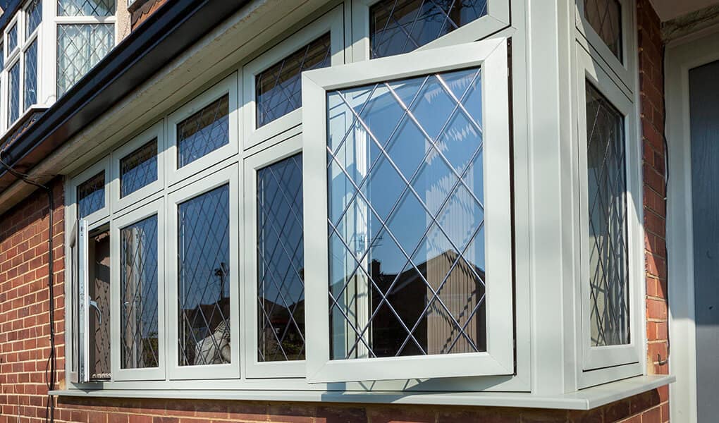 Flush sash bay window with leaded glass