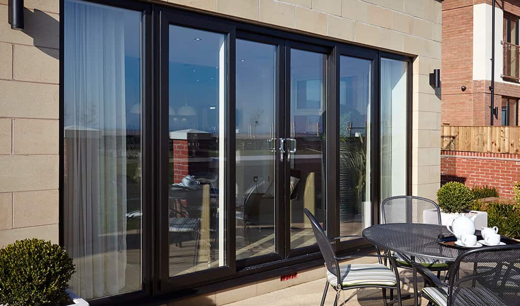 Tall black uPVC patio door installation