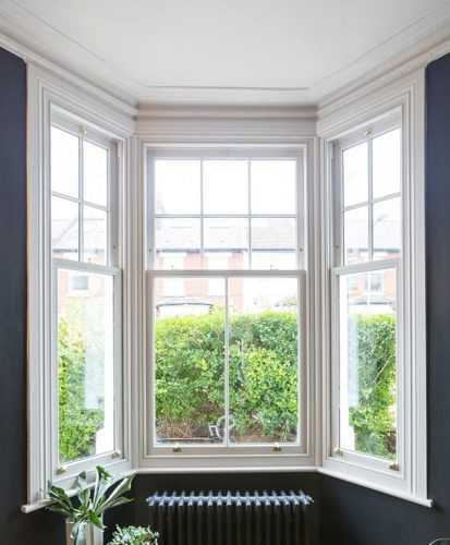 White timber bow vertical sliding windows