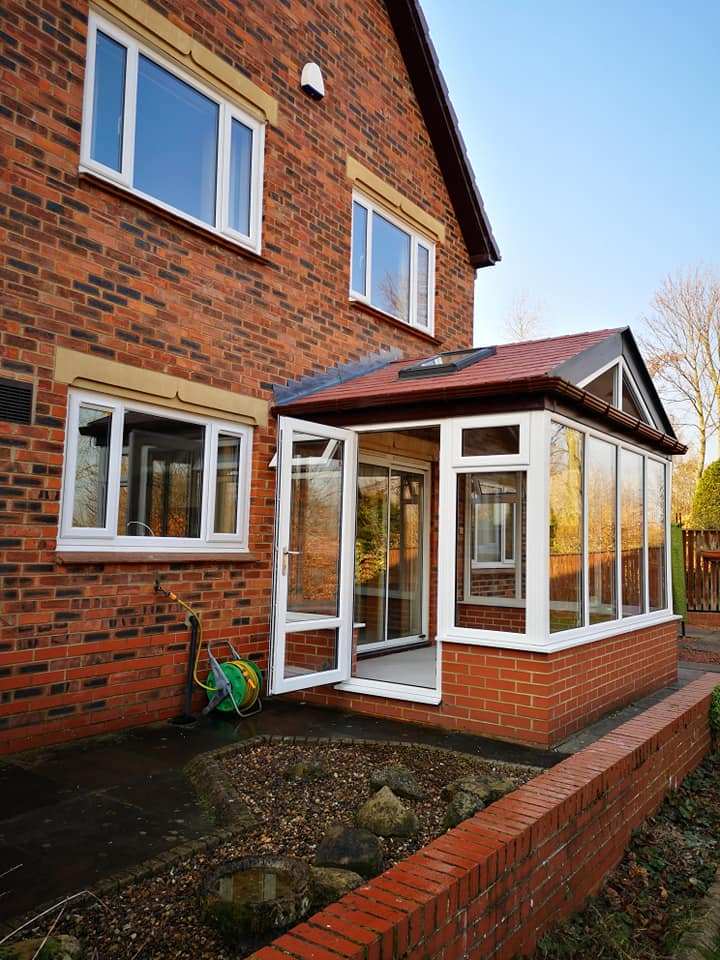 WarmerRoof Lean to tiled roof conservatory in brick red