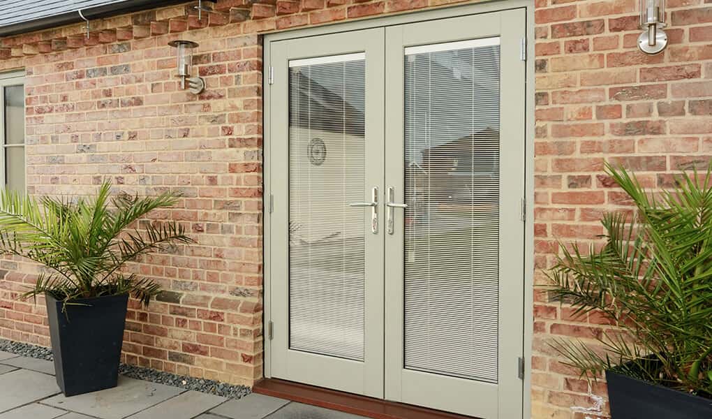 Timber french door painted green