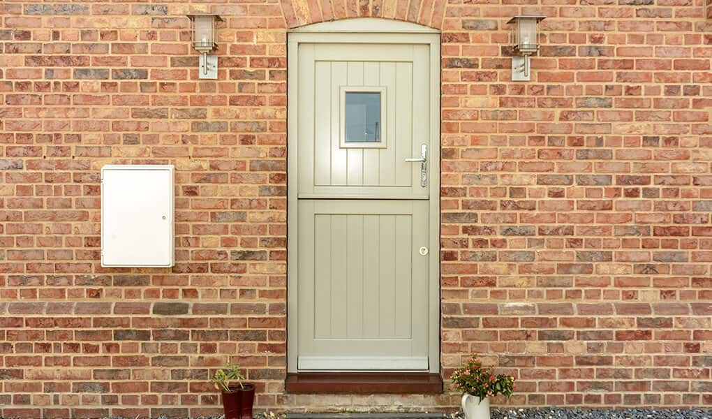 Green timber stable door installation