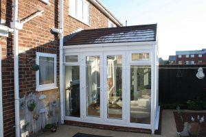Gable conservatory with black tiled roof