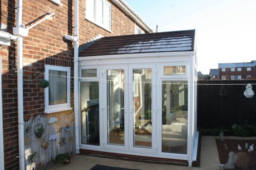 Gable conservatory with black tiled roof
