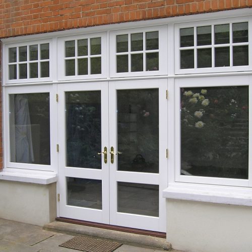 Traditional French doors with sidelights and astragal bars