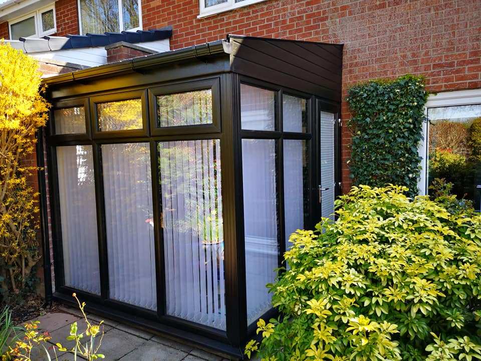 Lean to conservatory with a replacement tiled roof