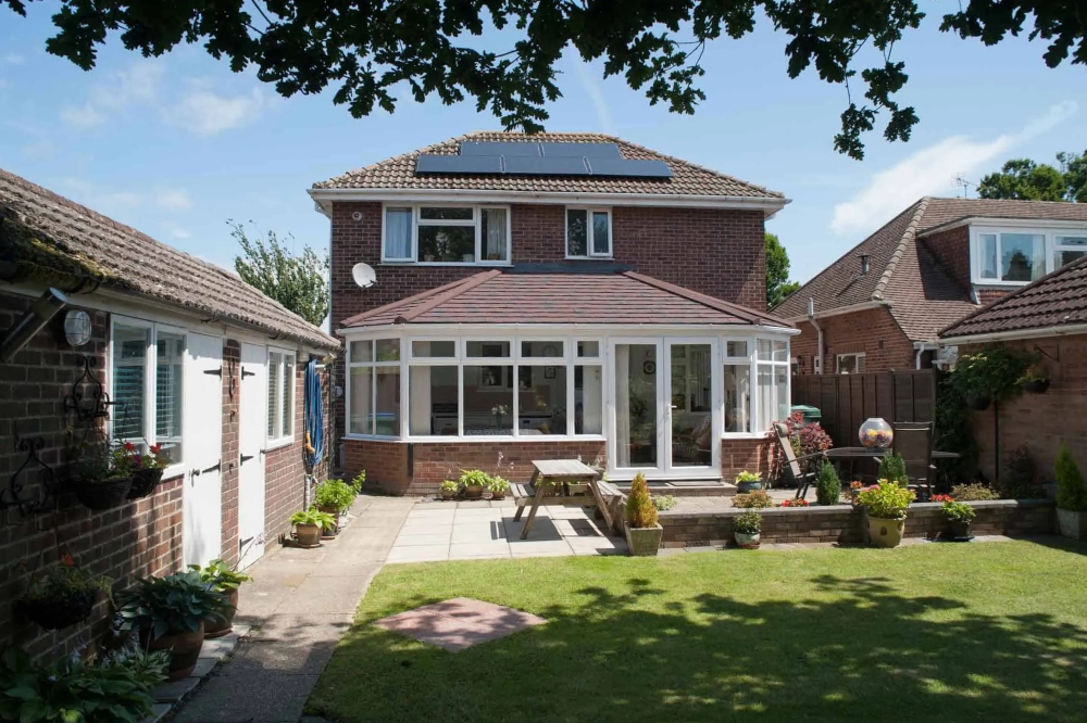 A lovely home with a lovely Guardian red Slate Roof.