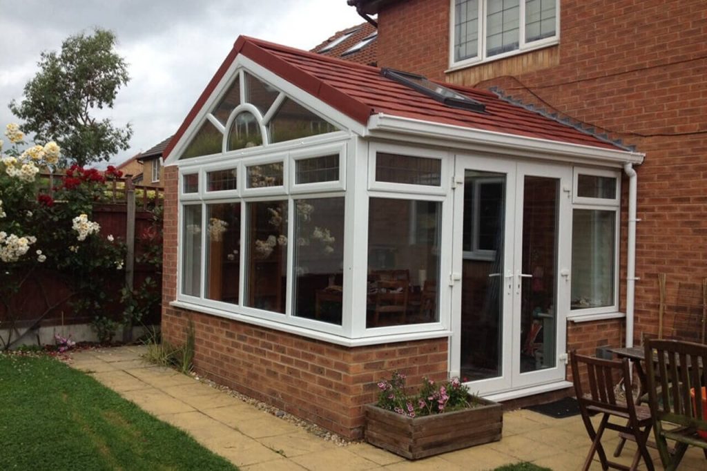 red tiled conservatory roof with french doors