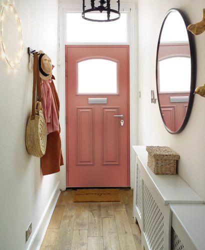 Inside view of a pink front door.