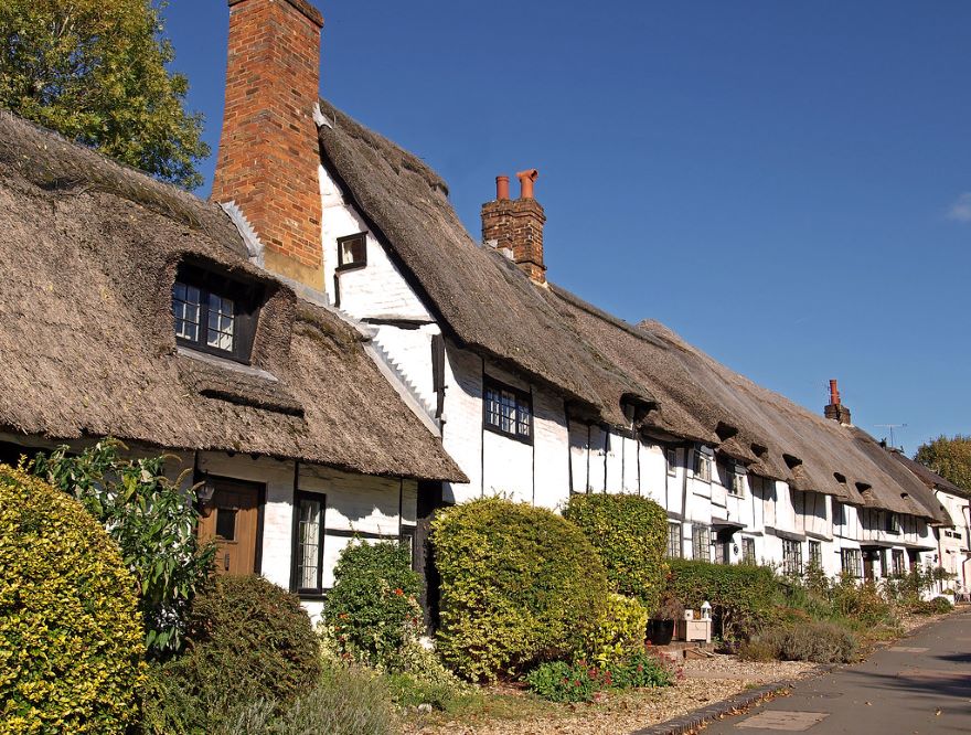 row of thatched cottages in conservation area