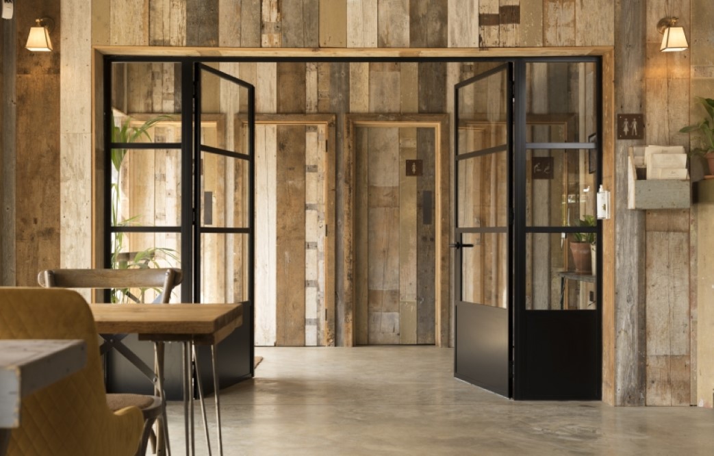 open aluminium internal french doors within wooden internal area